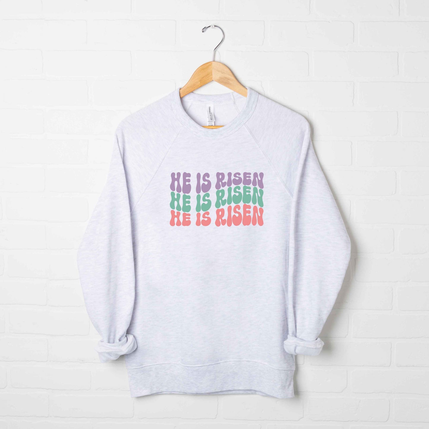 He Is Risen Stacked Wavy Colorful | Bella Canvas Premium Sweatshirt