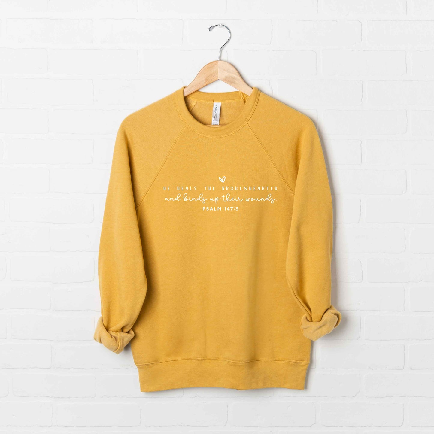 He Heals The Brokenhearted | Bella Canvas Premium Sweatshirt