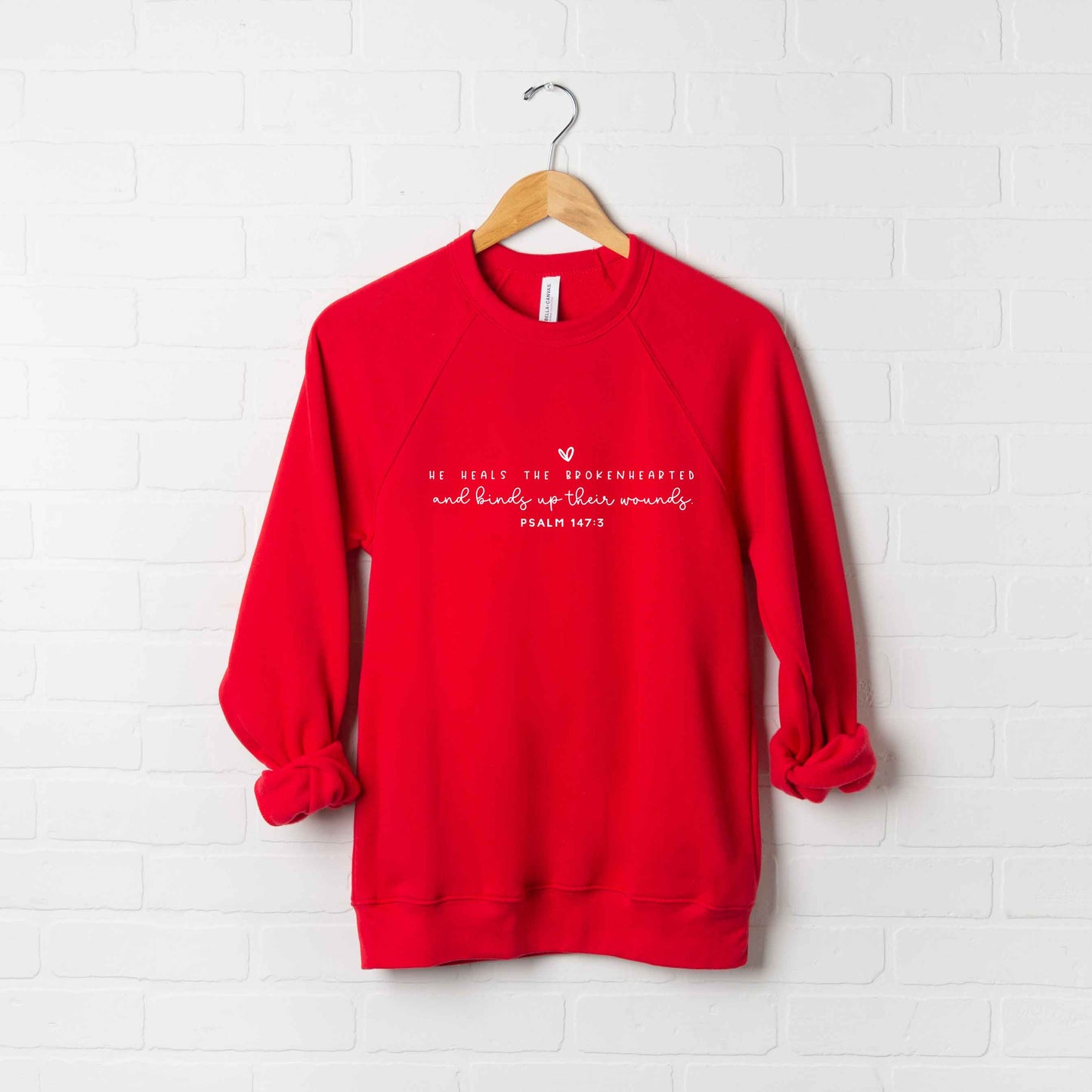 He Heals The Brokenhearted | Bella Canvas Premium Sweatshirt